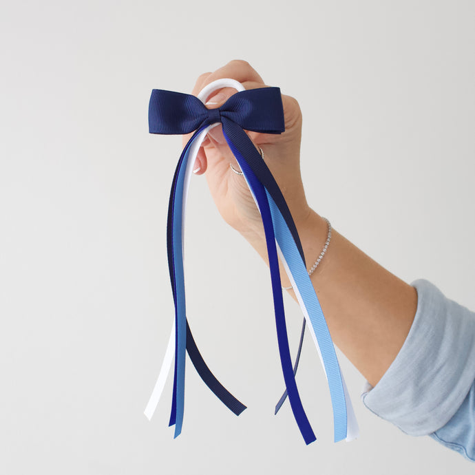 Large blue tail pinch ribbon bows