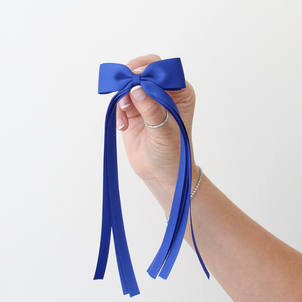 Large royal blue tail pinch ribbon bows