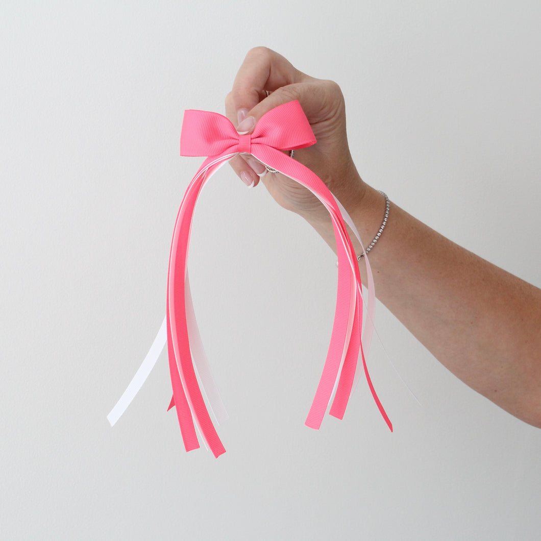 Large bright pink tail pinch ribbon bows