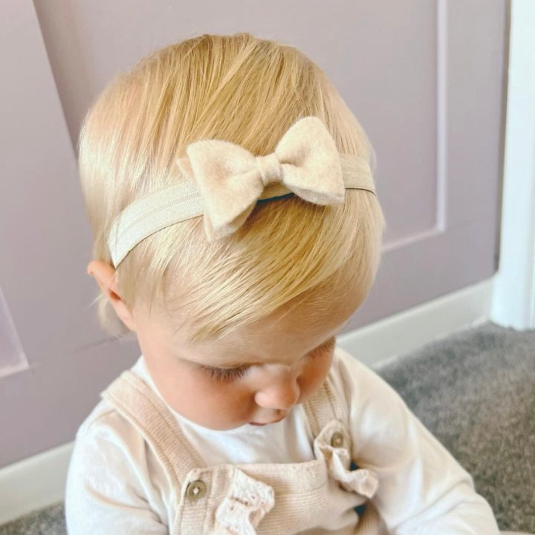 Beige small luxury felt bow